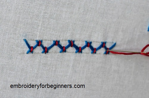 working on the cross of the stitch